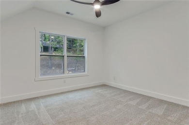 This stunning new construction blends luxury, functionality, and on The Highlands Course at Lake Arrowhead in Georgia - for sale on GolfHomes.com, golf home, golf lot