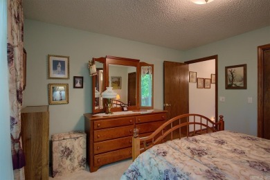 A SERENE RETREAT!  Meticulously landscaped, this tastefully on Cortez Golf Course in Arkansas - for sale on GolfHomes.com, golf home, golf lot