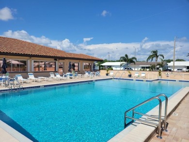 Welcome to Mainlands, an active 55+ golf cart-friendly community on Mainlands Golf Club in Florida - for sale on GolfHomes.com, golf home, golf lot