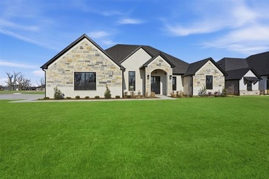 Located on a prime corner lot in the highly sought-after country on Pecan Plantation Country Club in Texas - for sale on GolfHomes.com, golf home, golf lot