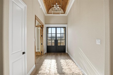 Located on a prime corner lot in the highly sought-after country on Pecan Plantation Country Club in Texas - for sale on GolfHomes.com, golf home, golf lot