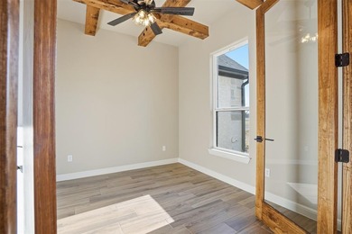 Located on a prime corner lot in the highly sought-after country on Pecan Plantation Country Club in Texas - for sale on GolfHomes.com, golf home, golf lot