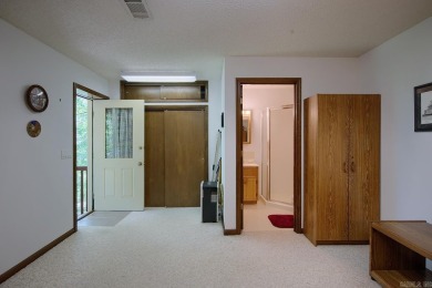 A SERENE RETREAT!  Meticulously landscaped, this tastefully on Cortez Golf Course in Arkansas - for sale on GolfHomes.com, golf home, golf lot