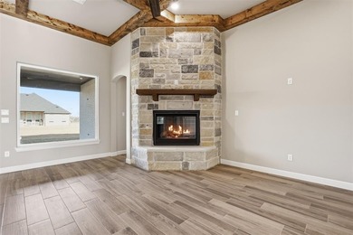 Located on a prime corner lot in the highly sought-after country on Pecan Plantation Country Club in Texas - for sale on GolfHomes.com, golf home, golf lot