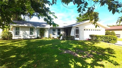 Discover this charming 3-bedroom, 2-bathroom (2 car garage) home on Lakewood Country Club in Florida - for sale on GolfHomes.com, golf home, golf lot