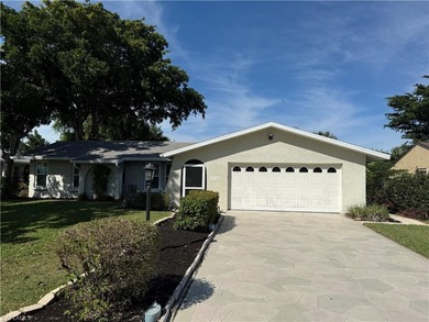 Discover this charming 3-bedroom, 2-bathroom (2 car garage) home on Lakewood Country Club in Florida - for sale on GolfHomes.com, golf home, golf lot