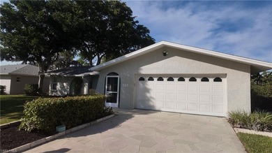Discover this charming 3-bedroom, 2-bathroom (2 car garage) home on Lakewood Country Club in Florida - for sale on GolfHomes.com, golf home, golf lot
