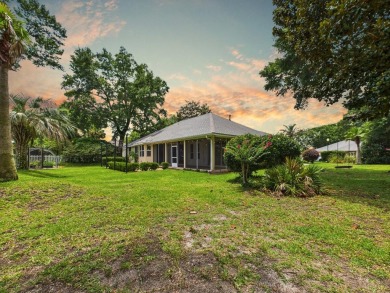 Situated on an oversized lot and a half, this beautifully on Fairway Oaks at Magnolia Golf Course in Florida - for sale on GolfHomes.com, golf home, golf lot