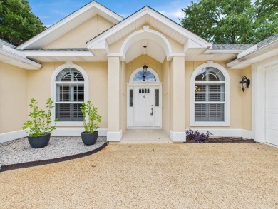 Situated on an oversized lot and a half, this beautifully on Fairway Oaks at Magnolia Golf Course in Florida - for sale on GolfHomes.com, golf home, golf lot
