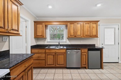 Welcome home this charming Fort Bayou Estates rancher with on Gulf Hills Golf Club in Mississippi - for sale on GolfHomes.com, golf home, golf lot