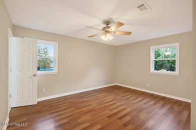 Welcome home this charming Fort Bayou Estates rancher with on Gulf Hills Golf Club in Mississippi - for sale on GolfHomes.com, golf home, golf lot