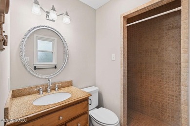 Welcome home this charming Fort Bayou Estates rancher with on Gulf Hills Golf Club in Mississippi - for sale on GolfHomes.com, golf home, golf lot