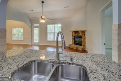 Perfect ranch home in popular Covington Place overlooking the on Indian Creek Golf Club in Georgia - for sale on GolfHomes.com, golf home, golf lot