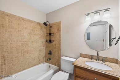 Welcome home this charming Fort Bayou Estates rancher with on Gulf Hills Golf Club in Mississippi - for sale on GolfHomes.com, golf home, golf lot