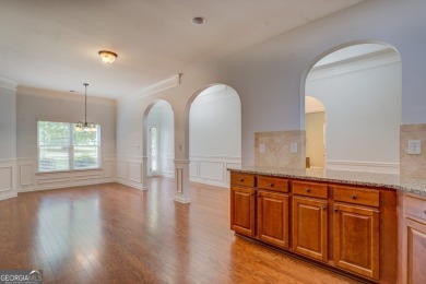 Perfect ranch home in popular Covington Place overlooking the on Indian Creek Golf Club in Georgia - for sale on GolfHomes.com, golf home, golf lot