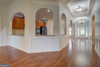 Perfect ranch home in popular Covington Place overlooking the on Indian Creek Golf Club in Georgia - for sale on GolfHomes.com, golf home, golf lot