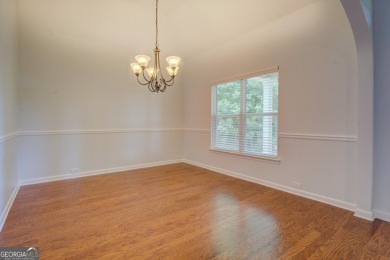 Perfect ranch home in popular Covington Place overlooking the on Indian Creek Golf Club in Georgia - for sale on GolfHomes.com, golf home, golf lot