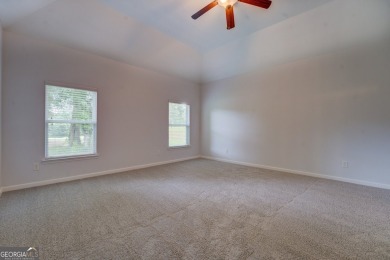 Perfect ranch home in popular Covington Place overlooking the on Indian Creek Golf Club in Georgia - for sale on GolfHomes.com, golf home, golf lot