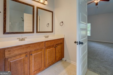 Perfect ranch home in popular Covington Place overlooking the on Indian Creek Golf Club in Georgia - for sale on GolfHomes.com, golf home, golf lot