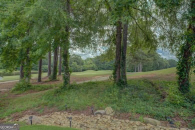 Perfect ranch home in popular Covington Place overlooking the on Indian Creek Golf Club in Georgia - for sale on GolfHomes.com, golf home, golf lot