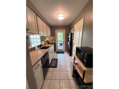 The 2 bed/2bath home with lake view is just what you are looking on The Oaks Golf Course in Missouri - for sale on GolfHomes.com, golf home, golf lot