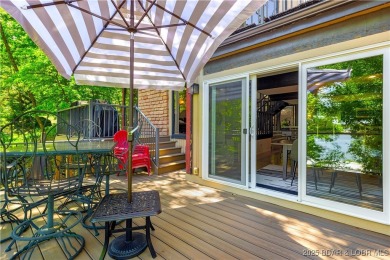 This magnificent 5-bedroom, 3-bathroom lakefront home is walking on The Oaks Golf Course in Missouri - for sale on GolfHomes.com, golf home, golf lot