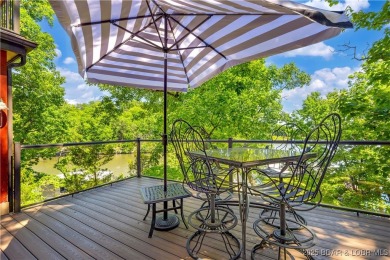 This magnificent 5-bedroom, 3-bathroom lakefront home is walking on The Oaks Golf Course in Missouri - for sale on GolfHomes.com, golf home, golf lot