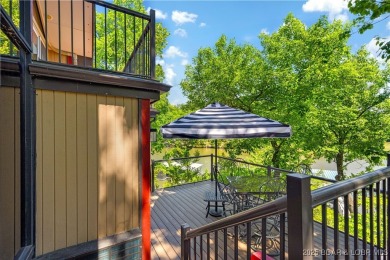 This magnificent 5-bedroom, 3-bathroom lakefront home is walking on The Oaks Golf Course in Missouri - for sale on GolfHomes.com, golf home, golf lot