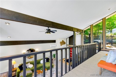 This magnificent 5-bedroom, 3-bathroom lakefront home is walking on The Oaks Golf Course in Missouri - for sale on GolfHomes.com, golf home, golf lot