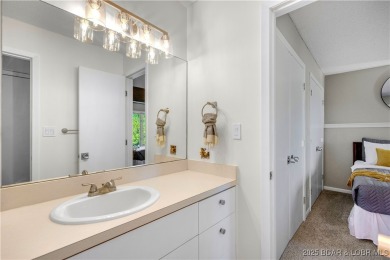This magnificent 5-bedroom, 3-bathroom lakefront home is walking on The Oaks Golf Course in Missouri - for sale on GolfHomes.com, golf home, golf lot
