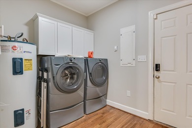 Discover this exceptional five-bedroom home featuring spacious on West Lake Country Club in Georgia - for sale on GolfHomes.com, golf home, golf lot