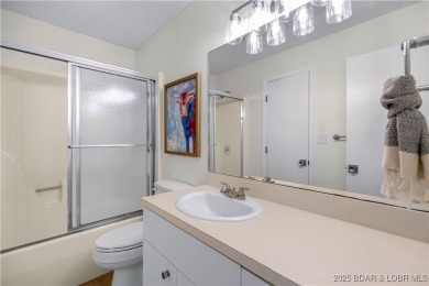 This magnificent 5-bedroom, 3-bathroom lakefront home is walking on The Oaks Golf Course in Missouri - for sale on GolfHomes.com, golf home, golf lot