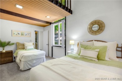 This magnificent 5-bedroom, 3-bathroom lakefront home is walking on The Oaks Golf Course in Missouri - for sale on GolfHomes.com, golf home, golf lot