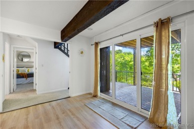 This magnificent 5-bedroom, 3-bathroom lakefront home is walking on The Oaks Golf Course in Missouri - for sale on GolfHomes.com, golf home, golf lot