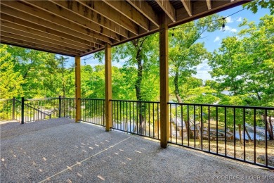 This magnificent 5-bedroom, 3-bathroom lakefront home is walking on The Oaks Golf Course in Missouri - for sale on GolfHomes.com, golf home, golf lot