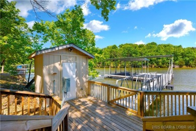 This magnificent 5-bedroom, 3-bathroom lakefront home is walking on The Oaks Golf Course in Missouri - for sale on GolfHomes.com, golf home, golf lot