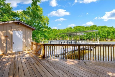 This magnificent 5-bedroom, 3-bathroom lakefront home is walking on The Oaks Golf Course in Missouri - for sale on GolfHomes.com, golf home, golf lot