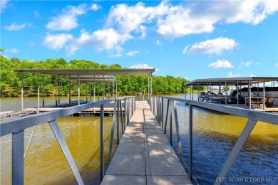 This magnificent 5-bedroom, 3-bathroom lakefront home is walking on The Oaks Golf Course in Missouri - for sale on GolfHomes.com, golf home, golf lot