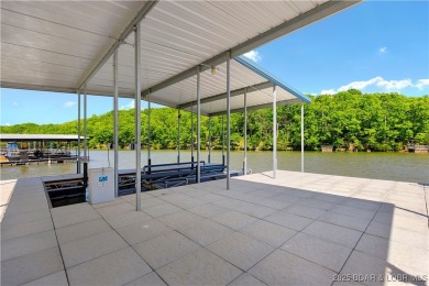 This magnificent 5-bedroom, 3-bathroom lakefront home is walking on The Oaks Golf Course in Missouri - for sale on GolfHomes.com, golf home, golf lot