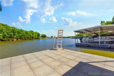 This magnificent 5-bedroom, 3-bathroom lakefront home is walking on The Oaks Golf Course in Missouri - for sale on GolfHomes.com, golf home, golf lot