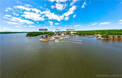 This magnificent 5-bedroom, 3-bathroom lakefront home is walking on The Oaks Golf Course in Missouri - for sale on GolfHomes.com, golf home, golf lot