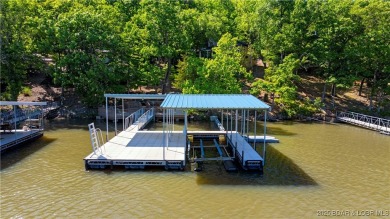 This magnificent 5-bedroom, 3-bathroom lakefront home is walking on The Oaks Golf Course in Missouri - for sale on GolfHomes.com, golf home, golf lot