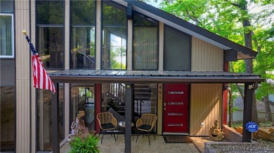 This magnificent 5-bedroom, 3-bathroom lakefront home is walking on The Oaks Golf Course in Missouri - for sale on GolfHomes.com, golf home, golf lot