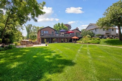 Welcome to your water oasis!  Beautiful all brick ranch with on Waters Edge Country Club in Michigan - for sale on GolfHomes.com, golf home, golf lot