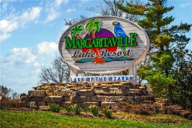 This magnificent 5-bedroom, 3-bathroom lakefront home is walking on The Oaks Golf Course in Missouri - for sale on GolfHomes.com, golf home, golf lot