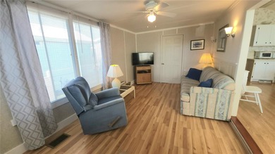 CHEERFUL HOME IN ACTIVE 55+ COMMUNITY! This one bed, 1 1/2 bath on River Run Golf Links in Florida - for sale on GolfHomes.com, golf home, golf lot