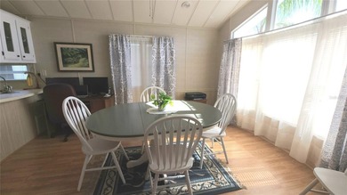 CHEERFUL HOME IN ACTIVE 55+ COMMUNITY! This one bed, 1 1/2 bath on River Run Golf Links in Florida - for sale on GolfHomes.com, golf home, golf lot