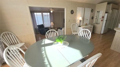 CHEERFUL HOME IN ACTIVE 55+ COMMUNITY! This one bed, 1 1/2 bath on River Run Golf Links in Florida - for sale on GolfHomes.com, golf home, golf lot