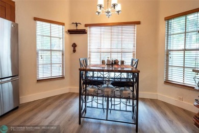 RARELY AVAILABLE VILLA OFFERING A CONTEMPORARY FEEL AND on Palm-Aire Country Club and Resort - The Oaks in Florida - for sale on GolfHomes.com, golf home, golf lot