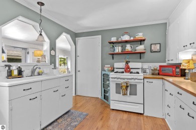 This four bedroom house with a double lot checks all the boxes on Elk Rapids Golf Club in Michigan - for sale on GolfHomes.com, golf home, golf lot